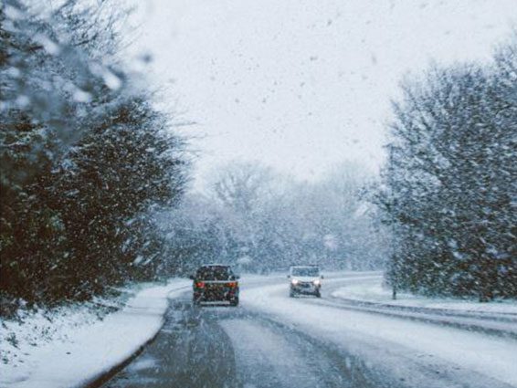 Snowy road with vehicles