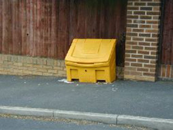 Yellow grit bin