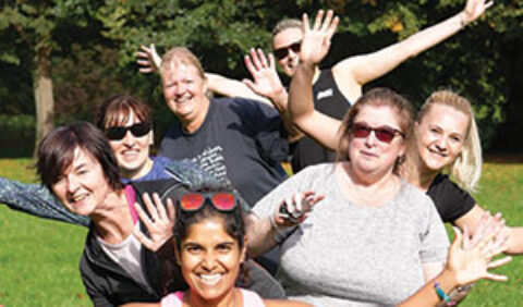 Group of exercisers in a park